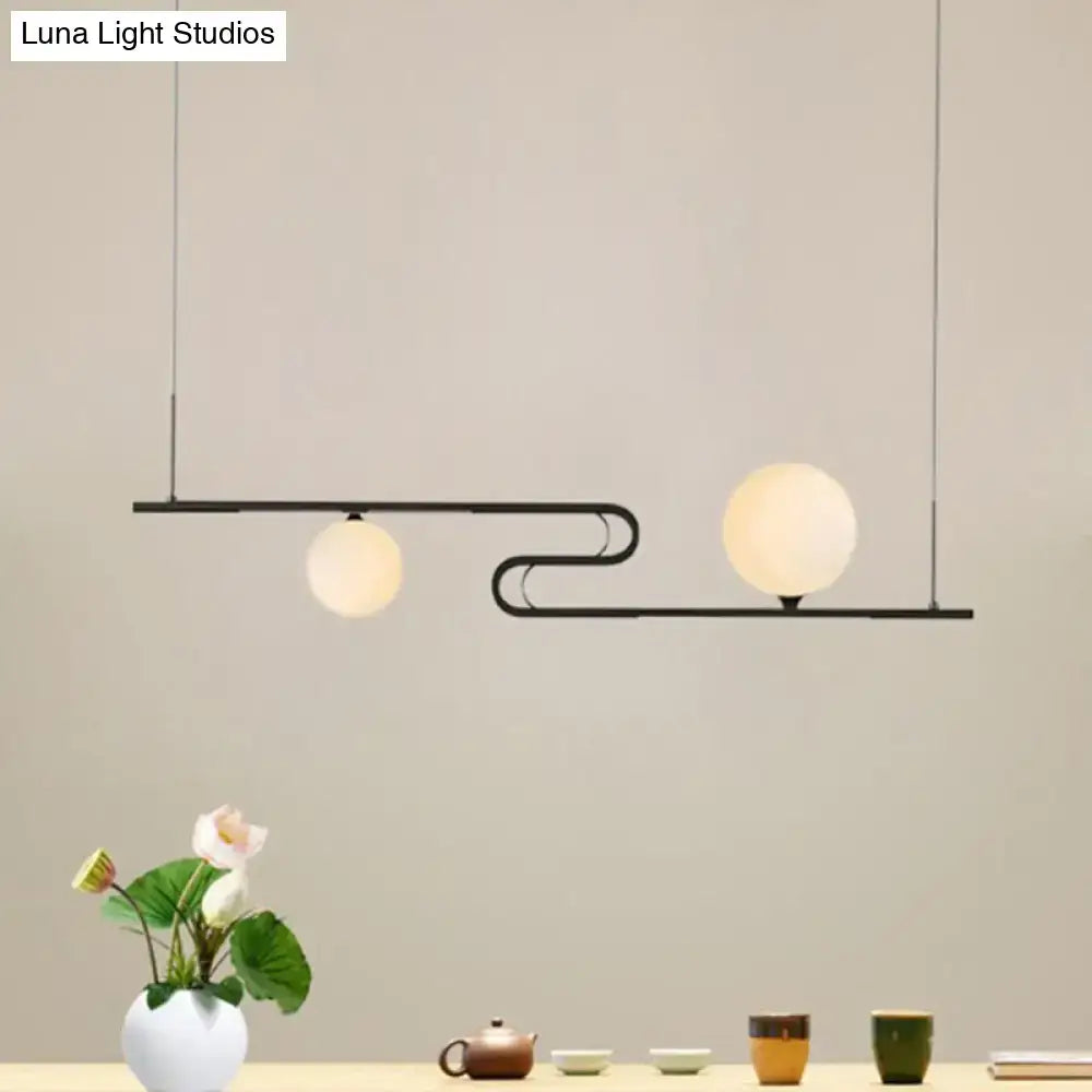 Modern black metal hanging chandelier with two frosted glass globe bulbs from DecorBites™ simplicity modo collection