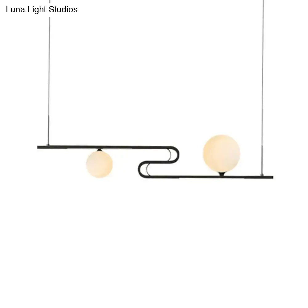 Modern black metal pendant light with two frosted glass globes from DecorBites simplicity modo hanging chandelier
