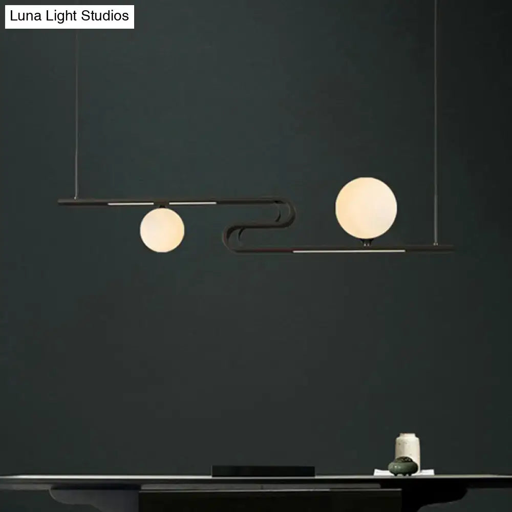 Modern black metal hanging chandelier with two frosted glass globes from DecorBites simplicity modo collection