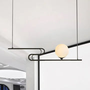 Black metal hanging chandelier with spherical frosted glass bulb from DecorBites™ simplicity modo for dining hall island