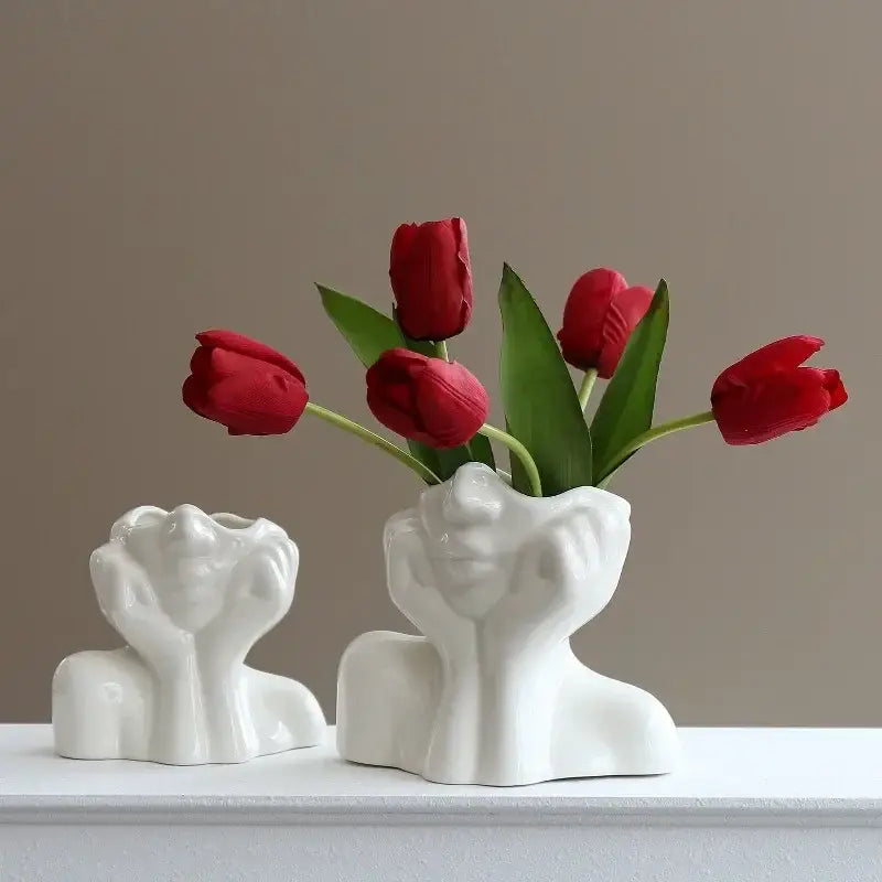 DecorBites™ modern white resin vase shaped like a human body bust with hands holding red tulips for body shaping decor