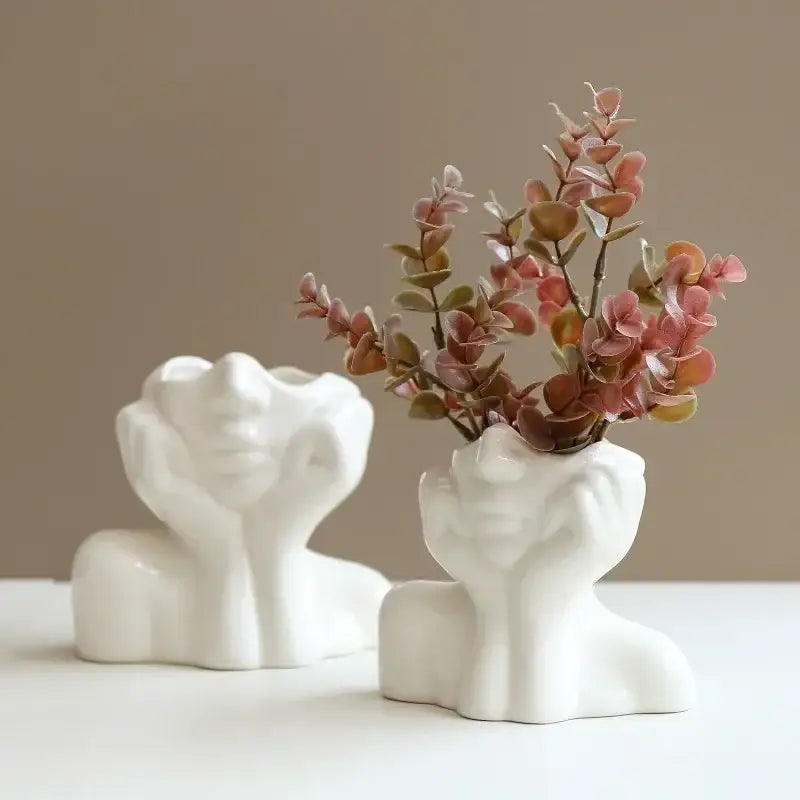 DecorBites™ modern white resin vase shaped like human body head and shoulders holding pink and green foliage