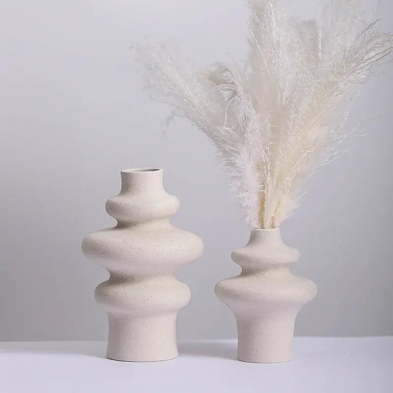 Cream-colored decorbites modern ins style ceramic spiral vase with textured speckled finish and stacked rounded tiers