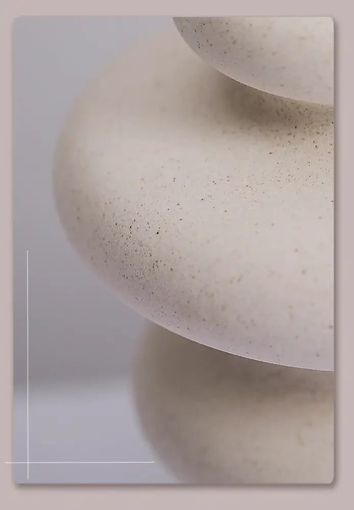 Cream-colored speckled stone balancing sculpture featured with DecorBites™ ins style ceramic spiral vase