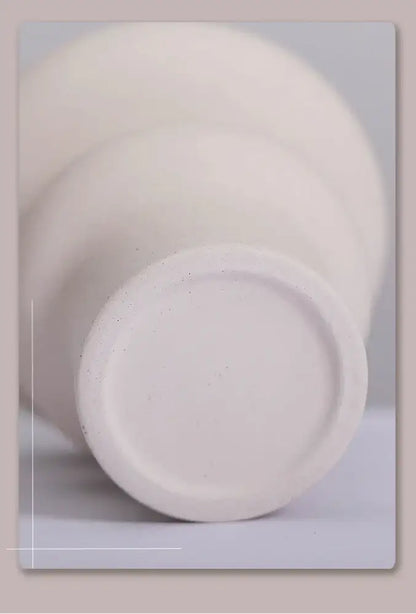 DecorBites™ modern ins style white ceramic spiral vase with a matte textured surface and rounded base