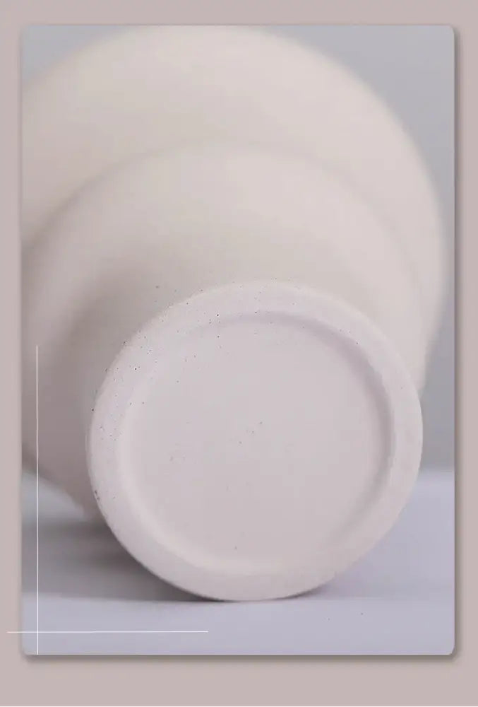 DecorBites™ modern ins style white ceramic spiral vase with a matte textured surface and rounded base