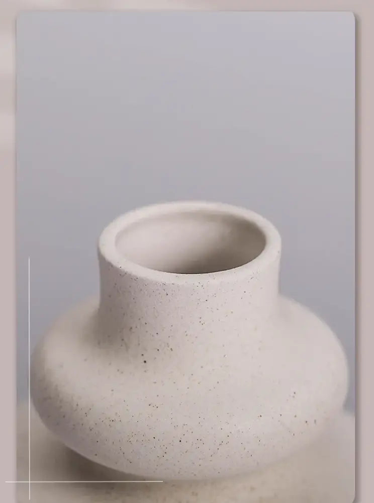 DecorBites™ modern ins style white ceramic spiral vase with minimalist off-white speckled bulbous base