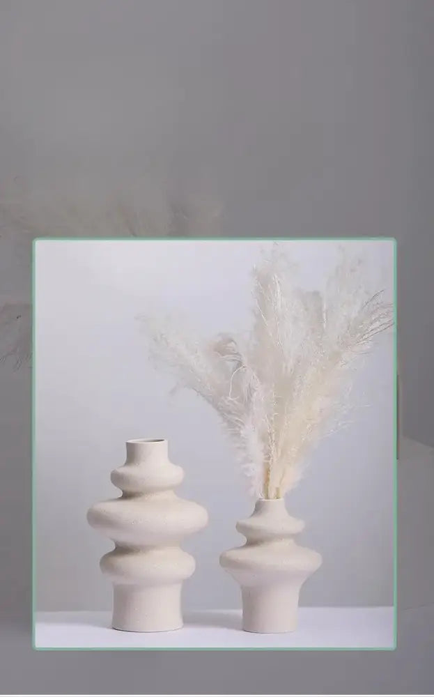 Two off-white DecorBites™ modern ins style ceramic spiral vases with stacked rounded tiers and minimalist design