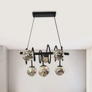 Black metal chandelier with five smoke gray glass shade globes ideal for modern dining room lighting