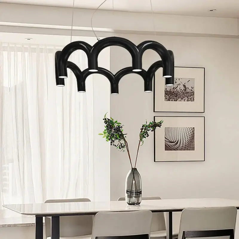 Decorbites modern led oblure arch chandelier in black features a sculptural wave-like design with integrated lights