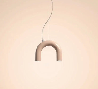 A sleek matte beige u-shaped oblure arch chandelier with minimalist design and thin metallic cord suspension