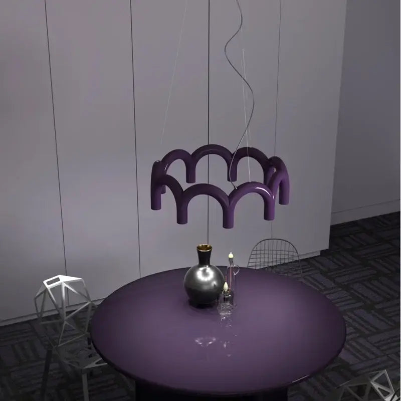 Purple glossy sculptural pendant light with modern wave design from decorbites oblure arch chandelier collection