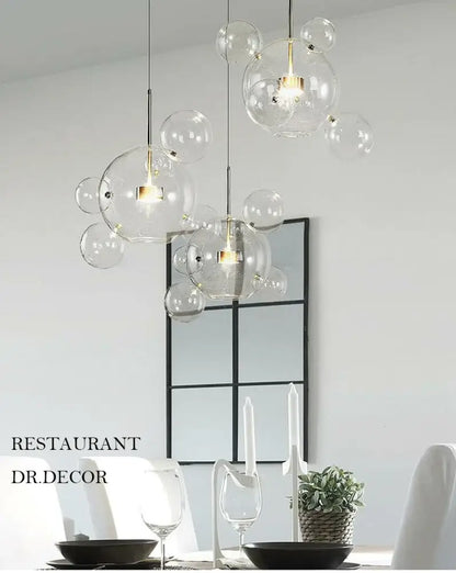Decorbites modern led bubble ball chandelier with clear glass bubble pendant lights and gold-toned fixtures for living room