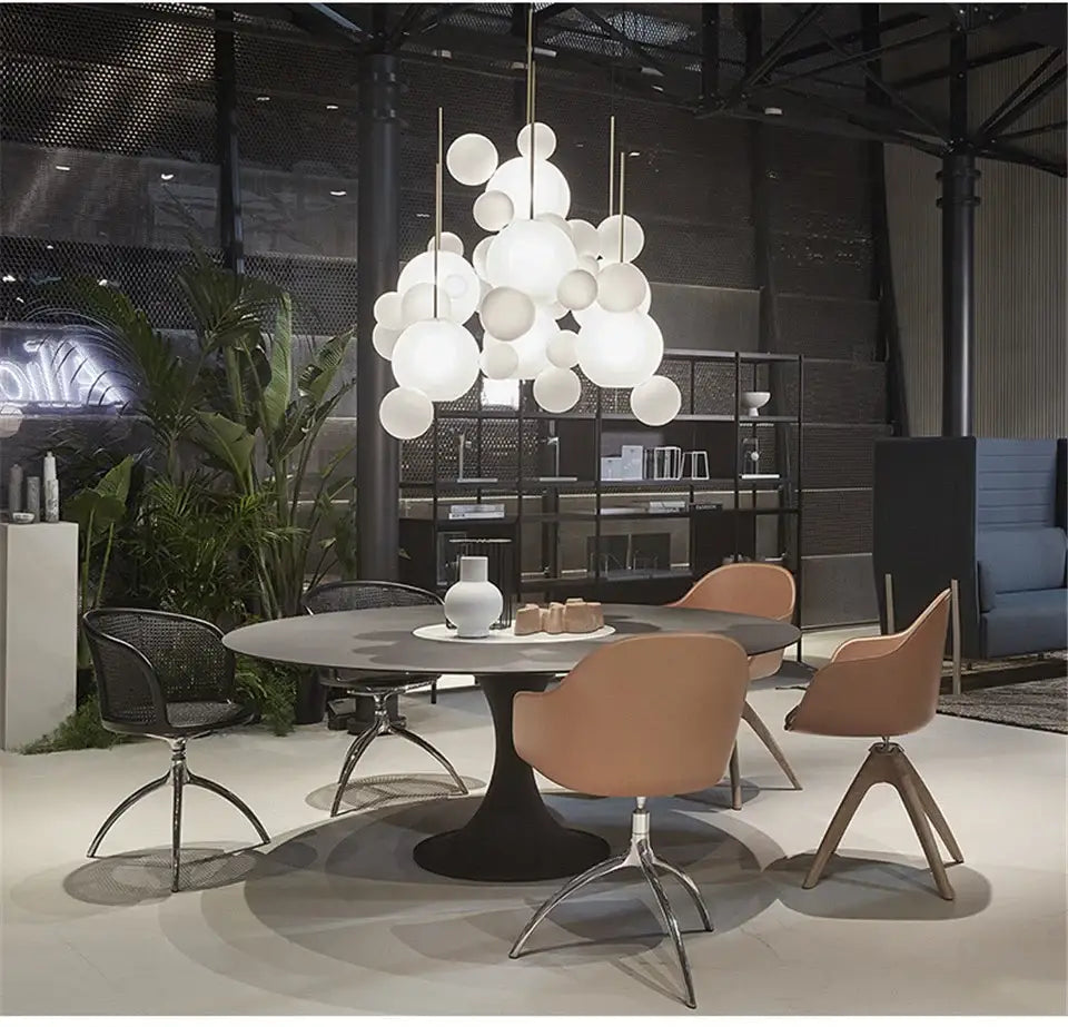 Modern white spherical decor led pendant light fixture hanging above dining table in nordic decor led style