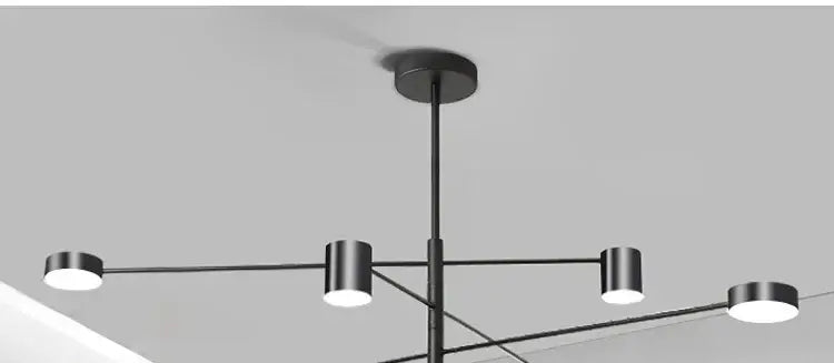 Decorbites modern led chandelier in gold black with four cylindrical metal light fixtures for living room and bedroom