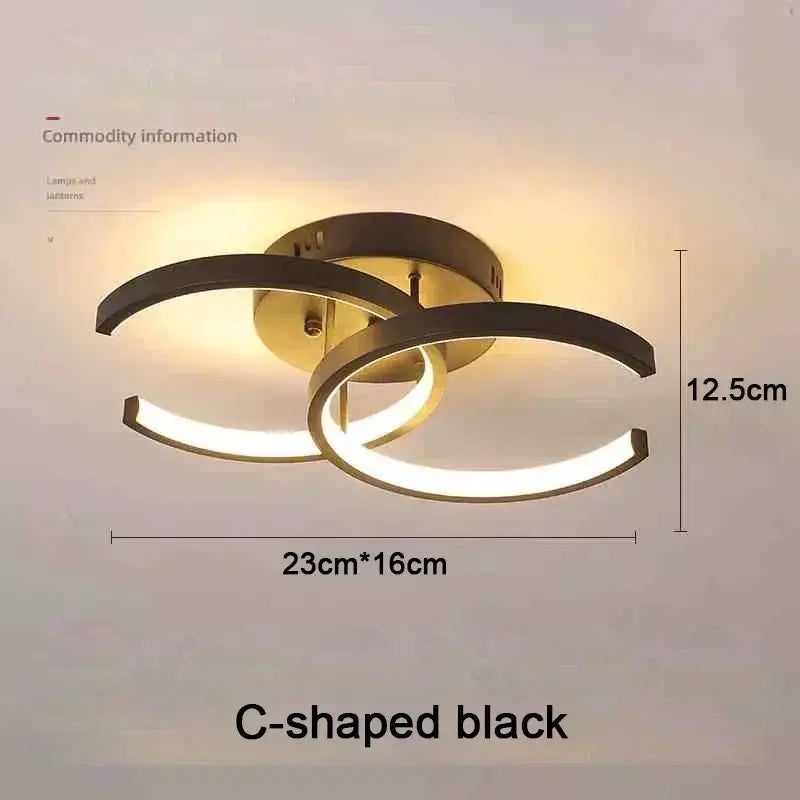 DecorBites™ modern black c-shaped led chandelier with sleek intersecting rings and warm glow in three color options