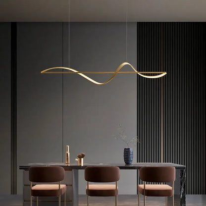 Gold-colored sleek curved pendant light with minimalist design for dining or bedroom in decorbites modern led chandeliers