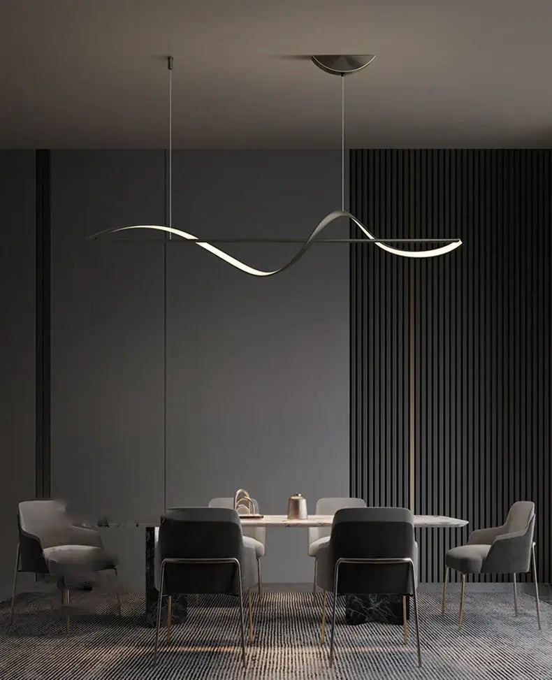 A sleek metallic pendant light with wave design from DecorBites™ modern led chandeliers for dining or bedroom