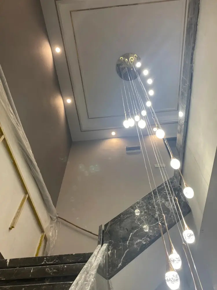 DecorBites™ modern led crystal chandelier with circular chrome fixture and multiple dangling spherical bulbs for home decor