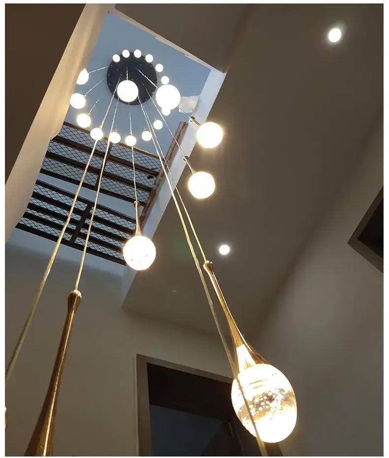 Decorbites modern led crystal chandelier featuring gold-toned rods and spherical glass bulbs for home decor