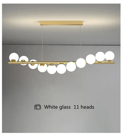 DecorBites modern led glass chandelier with gold-toned bar and eleven white globe bulbs for dining room lighting