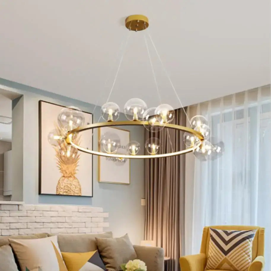 Gold-toned modern LED chandelier with clear glass bubble bulbs and adjustable cord by DecorBites™