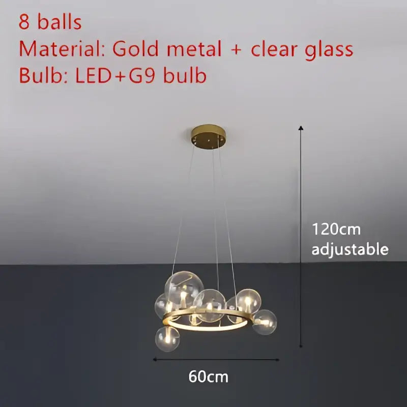 Gold metal chandelier featuring clear glass bubble spheres with LED g9 bulbs and an adjustable cord by DecorBites™