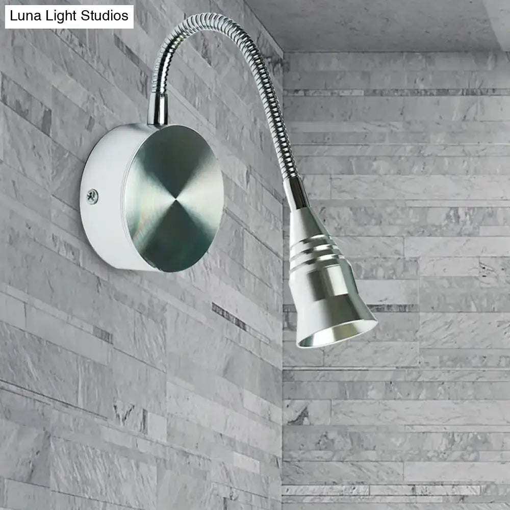 Silver gooseneck sconce lamp with flexible metallic arm and brushed finish head for direct wired electric installation