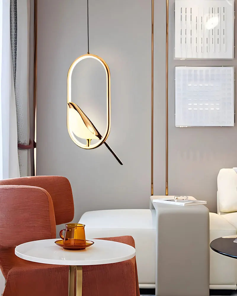 Gold-toned oval DecorBites modern magpie bird led pendant light with sleek design and warm ambient glow