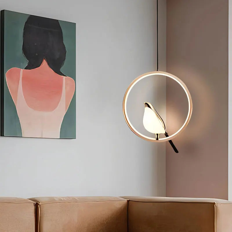 DecorBites modern magpie bird led pendant light with circular gold frame and illuminated bird-shaped lampshade