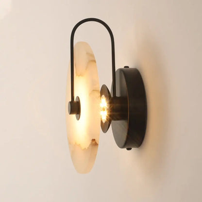 DecorBites modern marble wall lamp with warm-toned alabaster shade and black metal frame for stylish marble wall decor