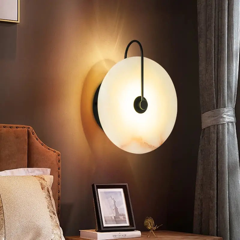 DecorBites™ modern marble wall lamp with warm-toned circular frosted glass shade and sleek black metal arm