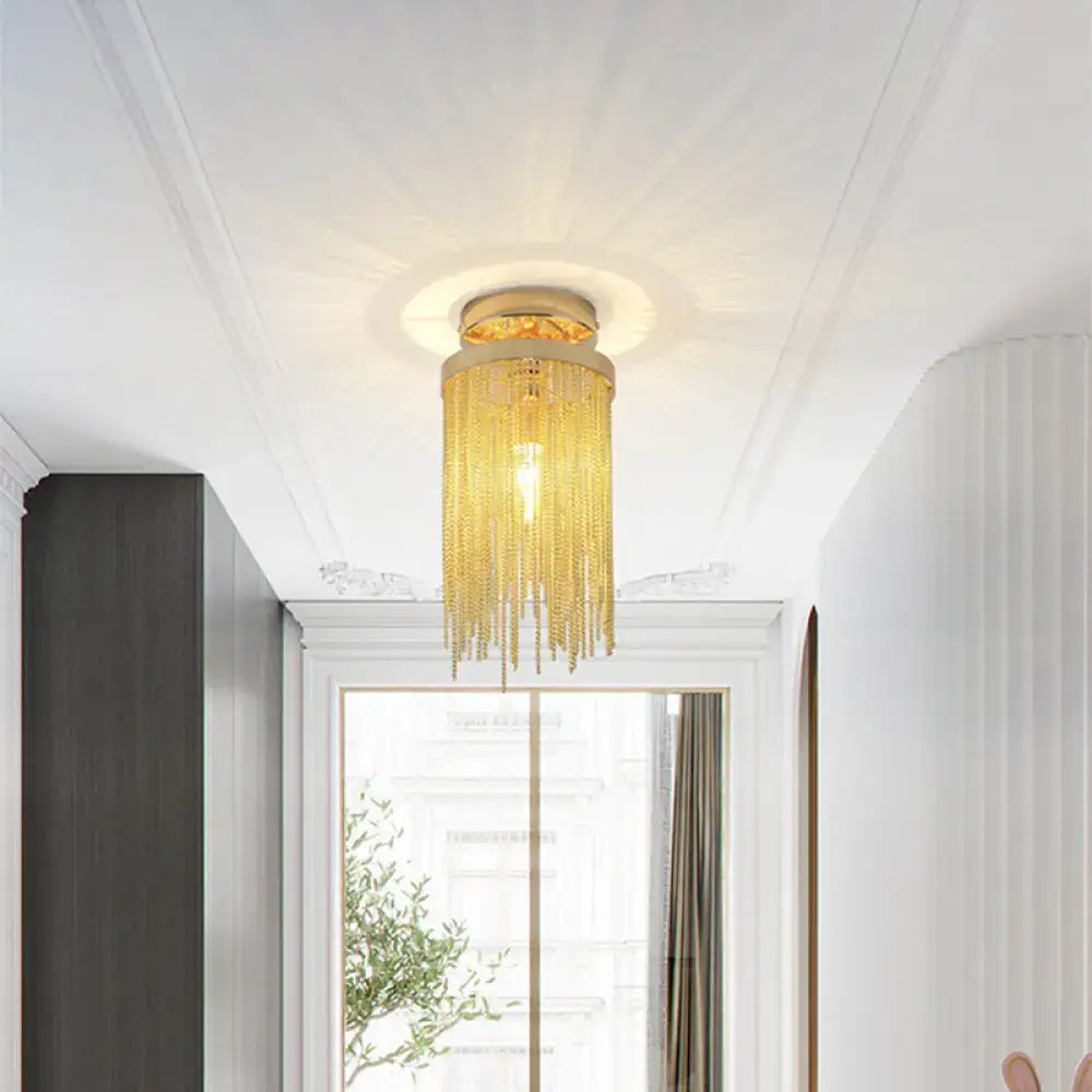 Gold-toned DecorBites™ modern metal semi flush mount lamp with cascading chain-like crystal strands for living room