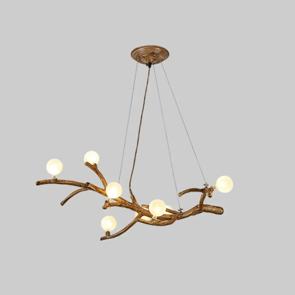 Bronze-finished decorbites™ modern metal tree branch chandelier with six glowing acrylic art deco ball shades