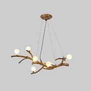 Bronze-finished decorbites™ modern metal tree branch chandelier with six glowing acrylic art deco ball shades