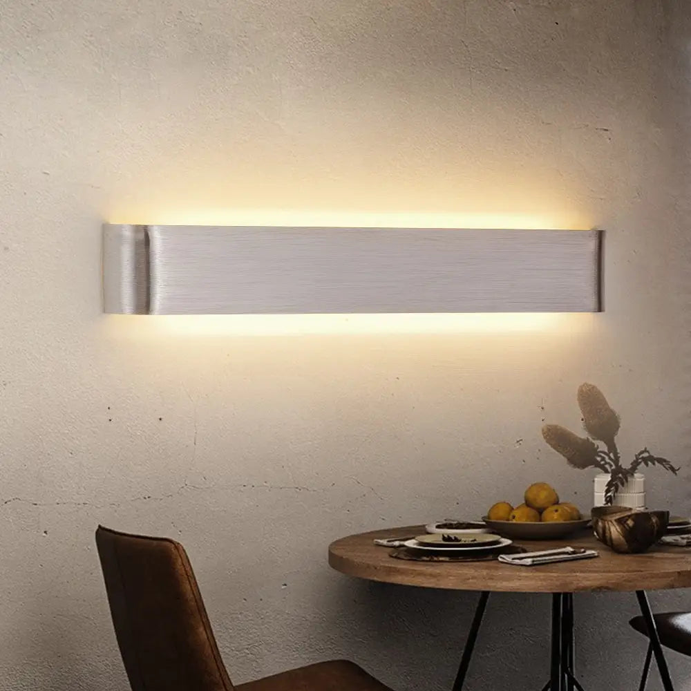 Modern metal wall sconces by DecorBites™ feature brushed silver rectangular design with warm ambient lighting