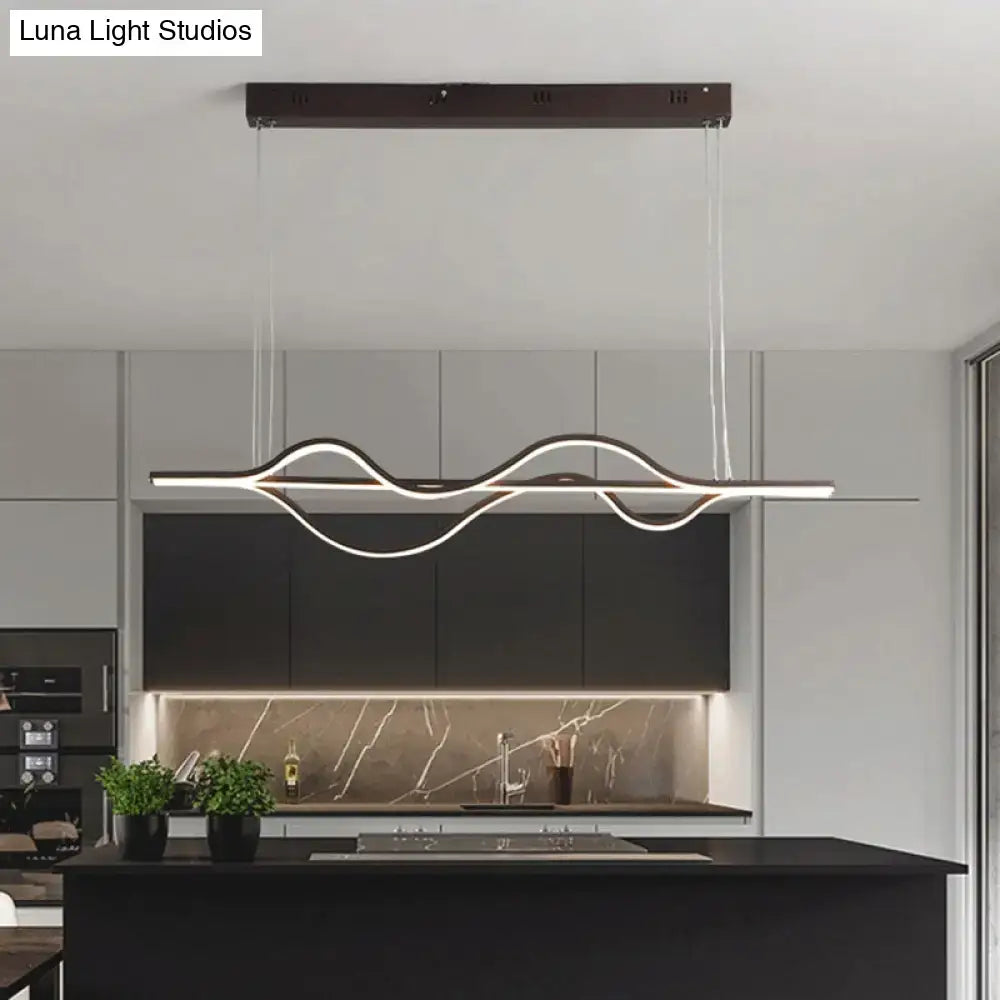 Modern minimalist pendant light in brushed black metal with glowing led strip and adjustable chain cord length for dining room