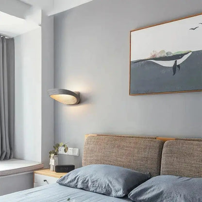 DecorBites modern minimalistic wall sconce in gray with sleek curved design and warm ambient lighting for minimalistic wall decor