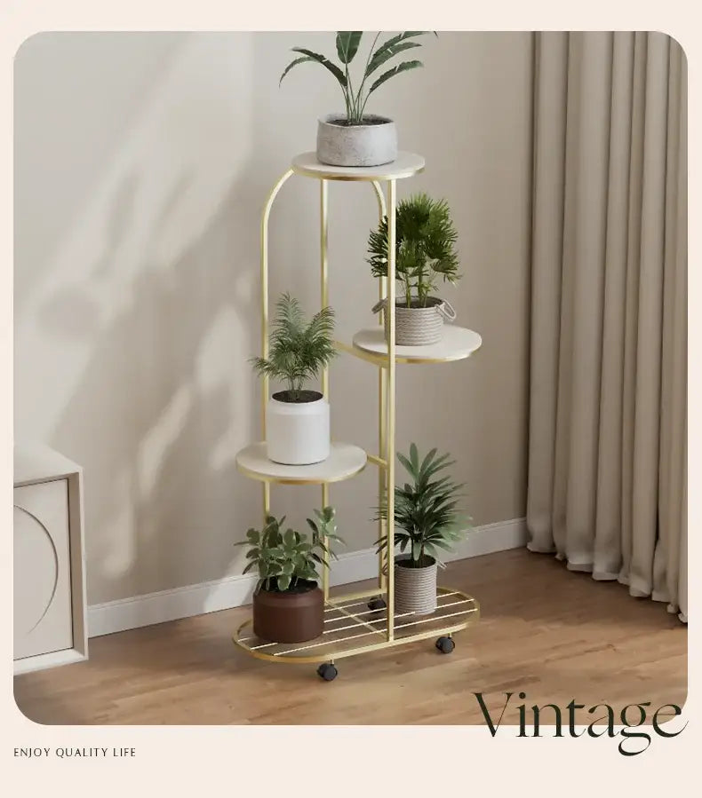 Gold metal plant stand with round white marble shelves and black caster wheels for interior decor flower rack
