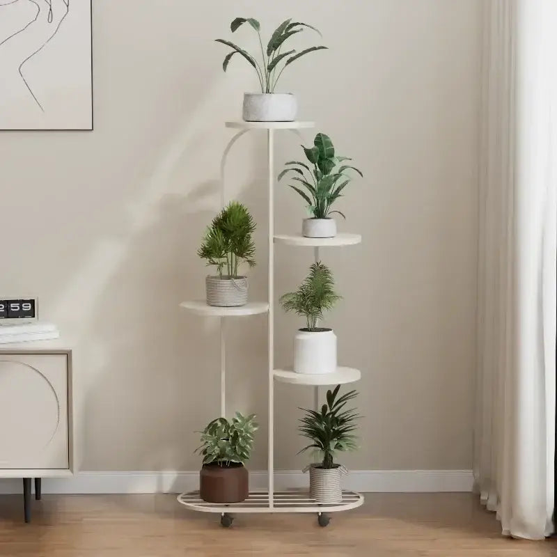 White five-tier metal plant stand with curved frame and wheels for interior decor and flower rack use by DecorBites™