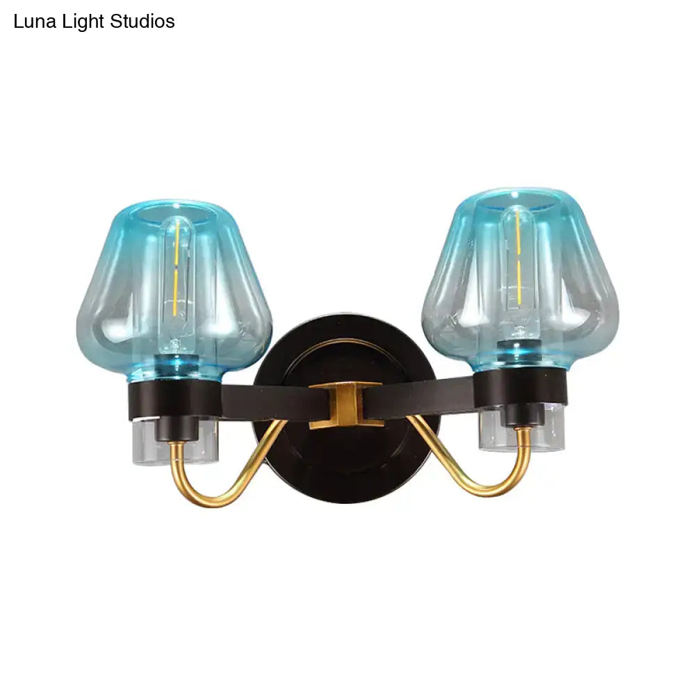 Decorbites modern mushroom direct wired bedroom sconce with translucent blue glass shades and black metal frame with gold accents