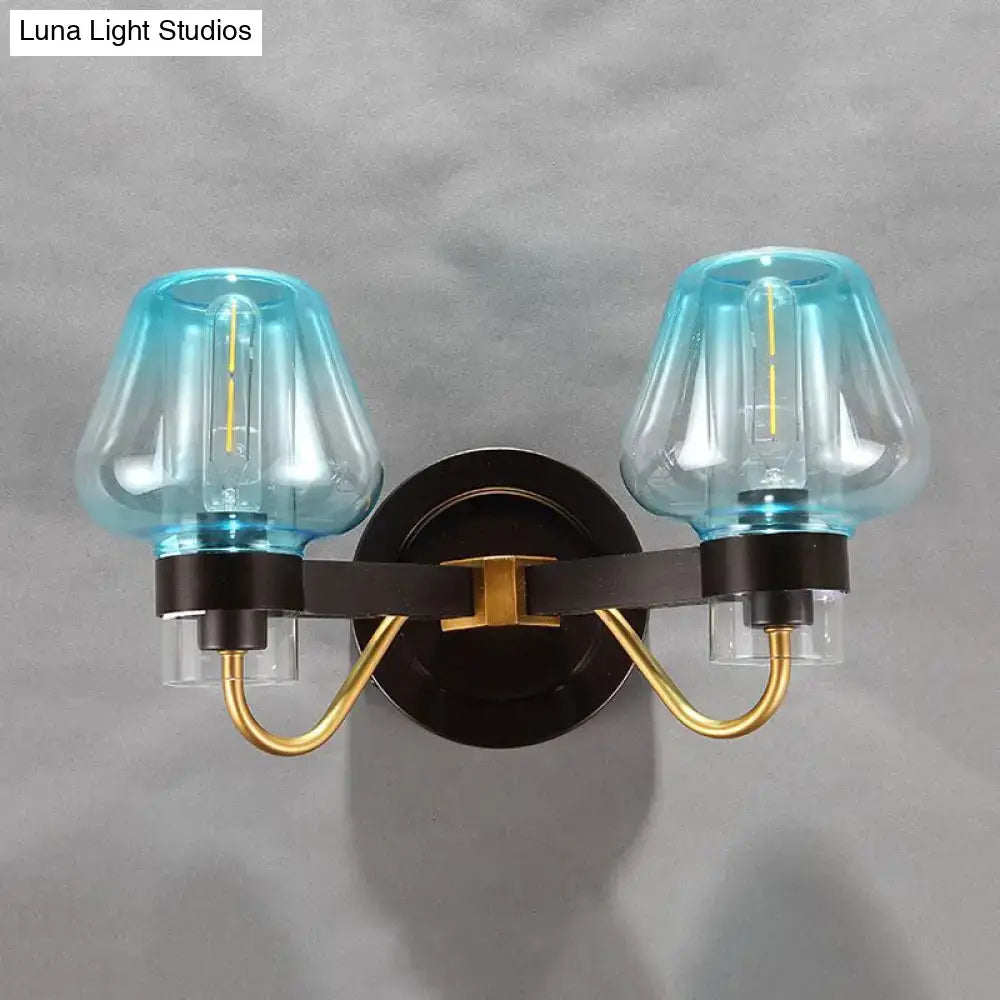 Decorbites modern mushroom direct wired bedroom sconce with turquoise glass shades and gold accented black metal frame