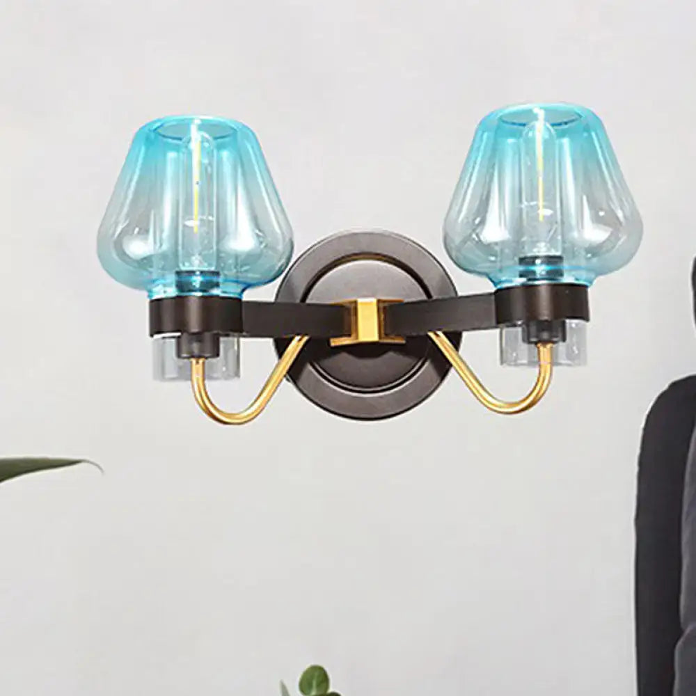 Blue glass direct wired electric bedroom sconce with gold and dark bronze accents from decorbites modern mushroom series