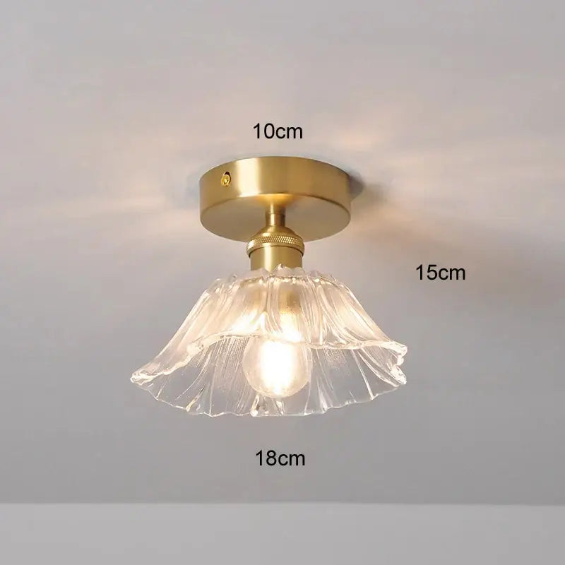 A delicate clear glass fluted lampshade with brass finish hanging e27 ceiling light from DecorBites modern nordic collection