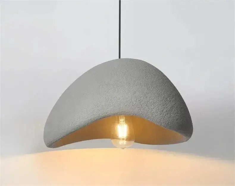 Gray concrete pendant light with warm gold interior and exposed bulb in decorbites modern nordic chandelier with warm light turn