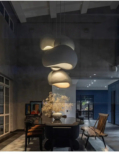 DecorBites modern nordic chandelier with matte white ceramic layered cloud-like shades emits warm light for home and dining