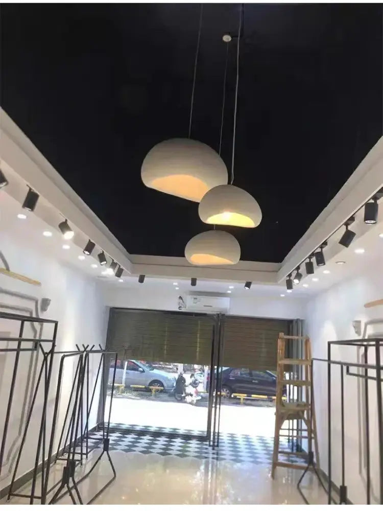 DecorBites™ modern nordic chandelier with three off-white dome-shaped pendant lights emitting warm light for home and dining