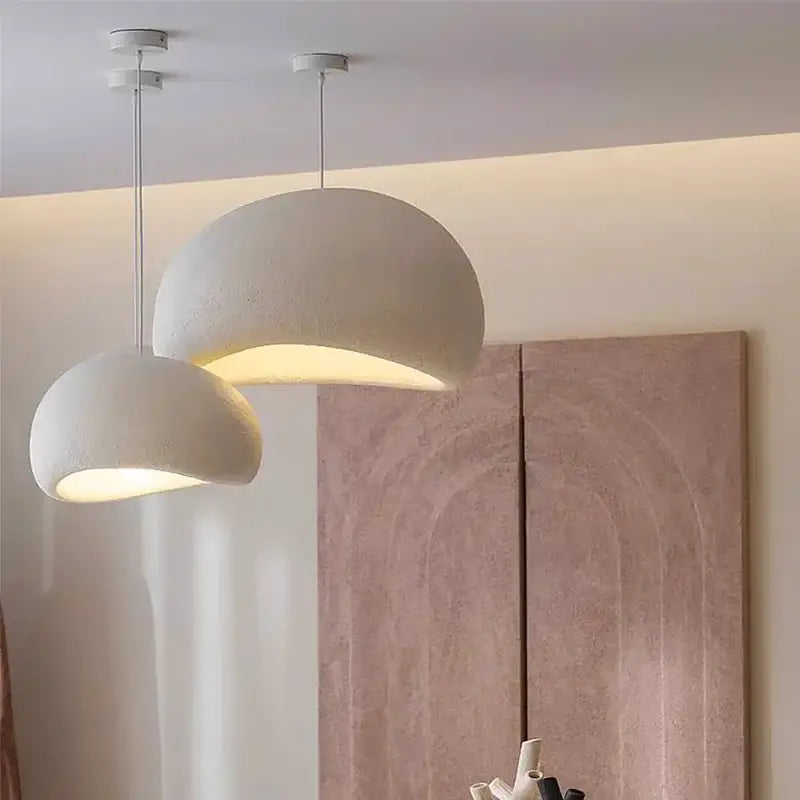 Two off-white matte textured pendant lights with dome shape in decorbites™ modern nordic chandelier for warm light ambiance