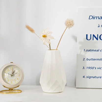 White ceramic diamond shaped flower vase with a faceted geometric design by DecorBites™ Modern Nordic