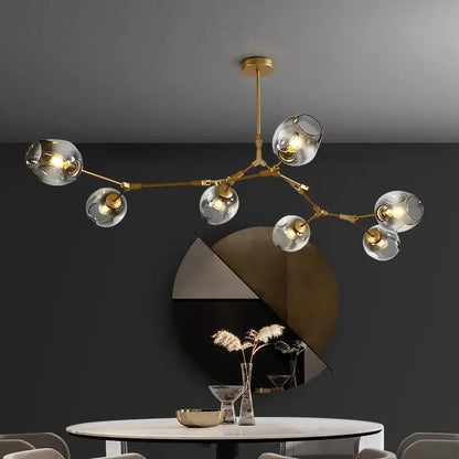 Gold-toned DecorBites modern nordic glass ball led chandelier with clear glass globe shades for elegant lighting